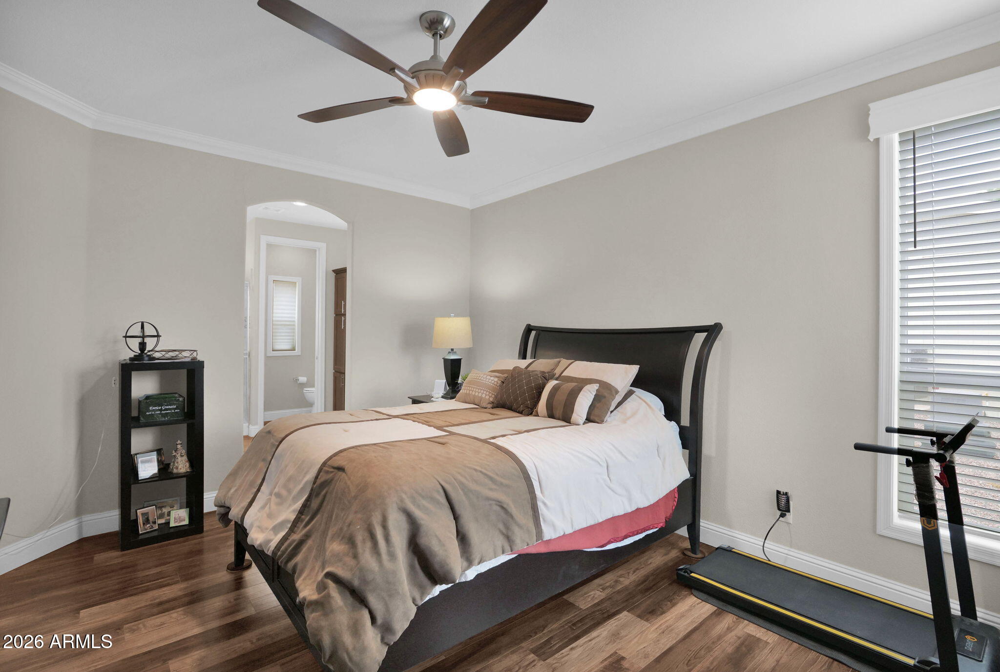 3300 East Broadway Road, Unit 252 Mesa, AZ 85204 - Photo 24 of 35 a bedroom with a bed and a chandelier