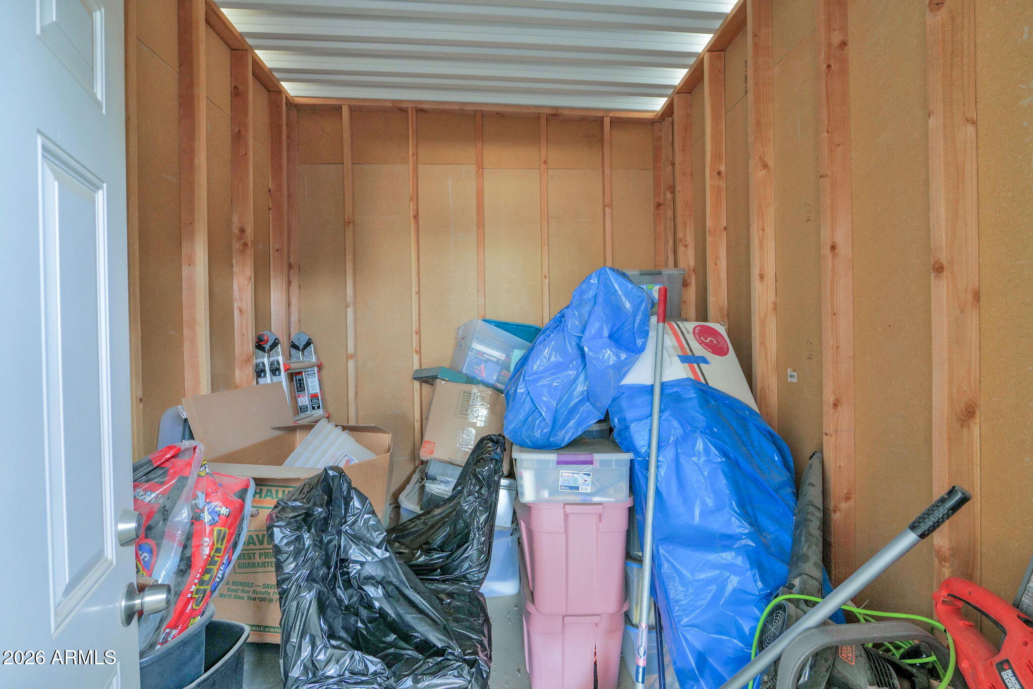 3300 East Broadway Road, Unit 252 Mesa, AZ 85204 - Photo 33 of 35 a view of walk in closet with clothes and shoes