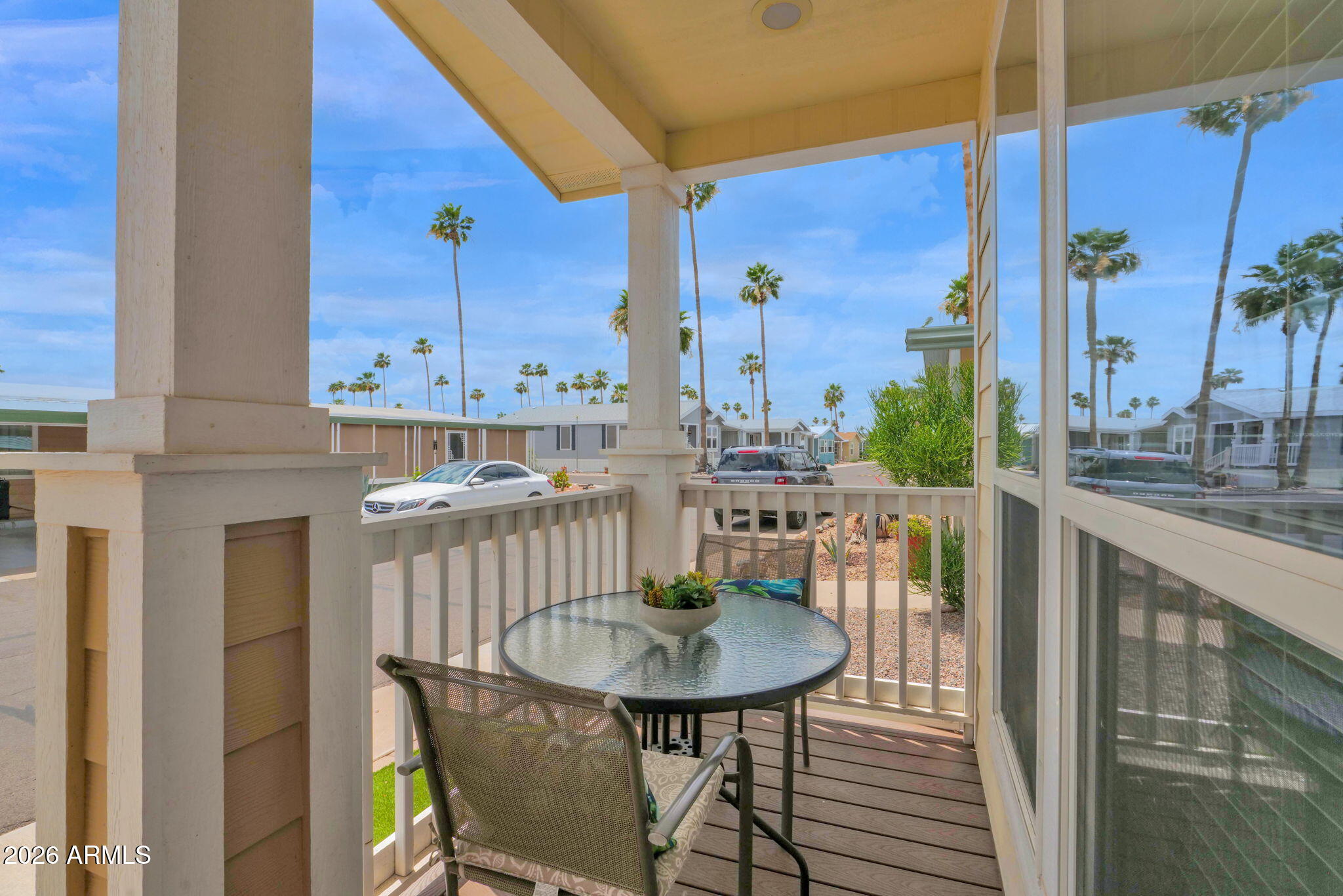 3300 East Broadway Road, Unit 252 Mesa, AZ 85204 - Photo 5 of 35 a view of a balcony dining table and chairs