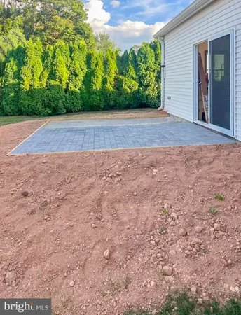 a view of backyard with green space