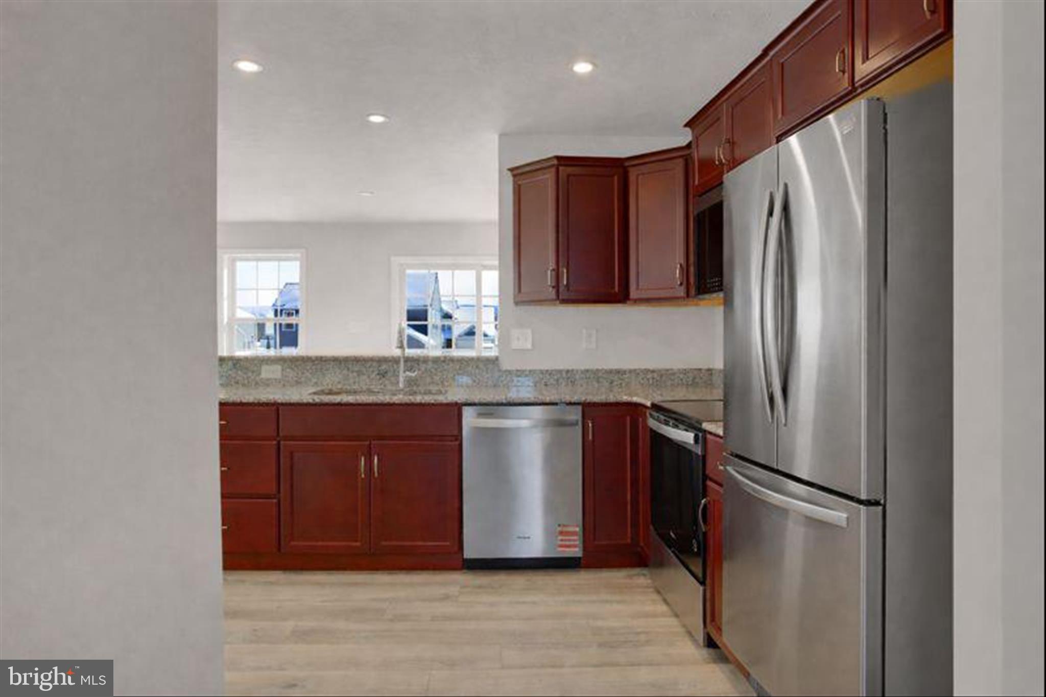 601 Exeter Lane Shippensburg, PA 17257 - Photo 13 of 48 a kitchen with stainless steel appliances granite countertop a refrigerator and a sink