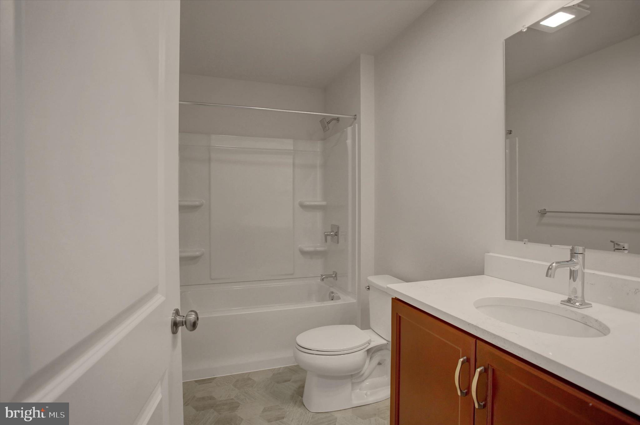 601 Exeter Lane Shippensburg, PA 17257 - Photo 35 of 48 a bathroom with a granite countertop toilet sink and shower