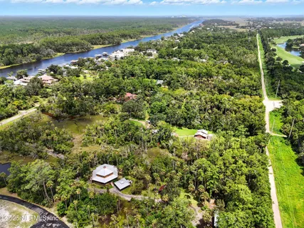 a view of a city with lush green forest