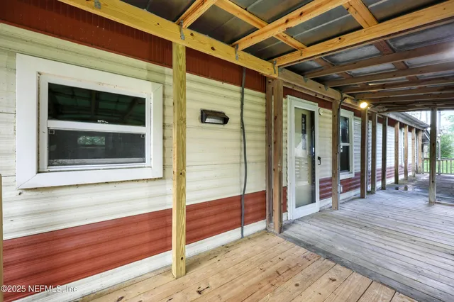 a view of hallway with wooden floor