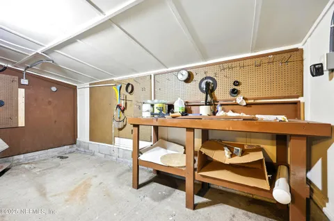 a view of an chairs and table in a room