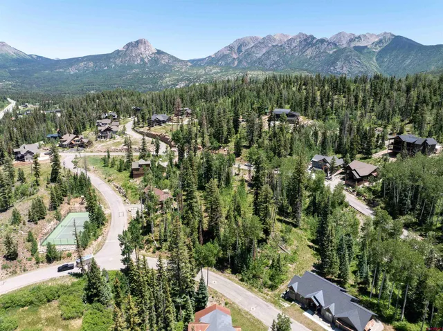 an aerial view of residential house with outdoor space and mountain view