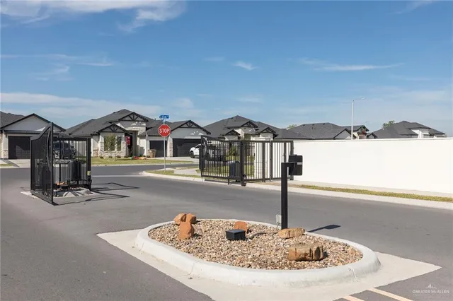 a swimming pool with a yard in the back