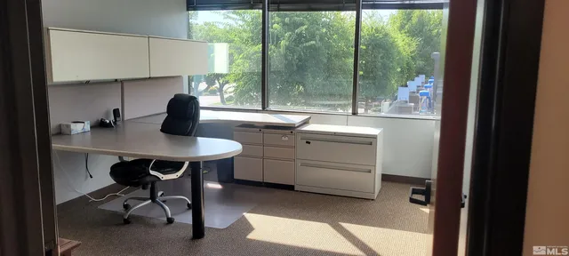 a kitchen with a sink appliances and cabinets