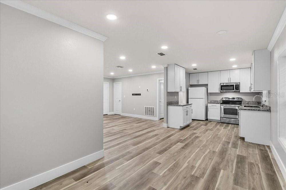 5804 Wolf Road Orlando, FL 32808 - Photo 15 of 24 a view of kitchen with wooden floor