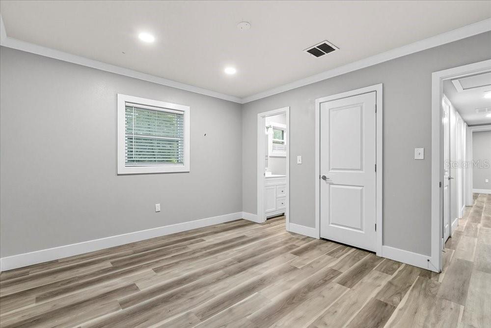 5804 Wolf Road Orlando, FL 32808 - Photo 18 of 24 a view of room with window and wooden floor