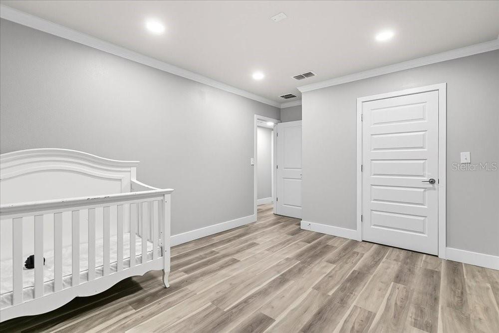 5804 Wolf Road Orlando, FL 32808 - Photo 21 of 24 a view of a hallway with closet