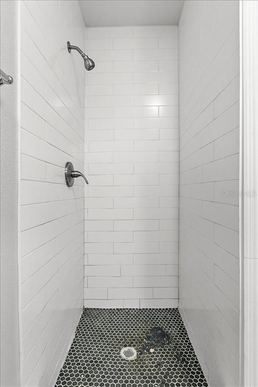 5804 Wolf Road Orlando, FL 32808 - Photo 6 of 24 a bathroom with a shower