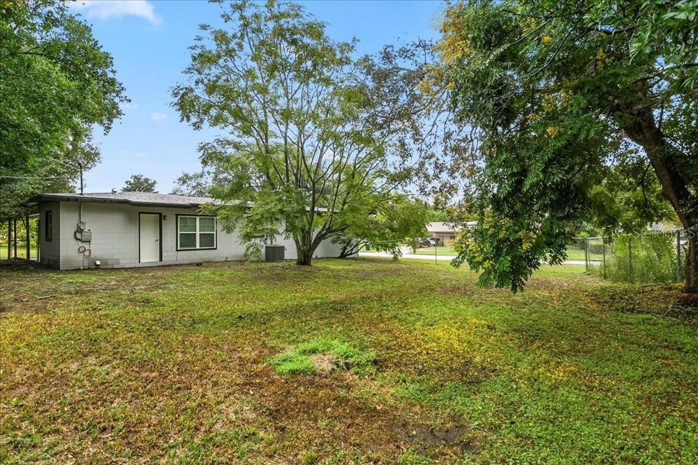 5804 Wolf Road Orlando, FL 32808 - Photo 7 of 24 a view of a house with yard and tree s