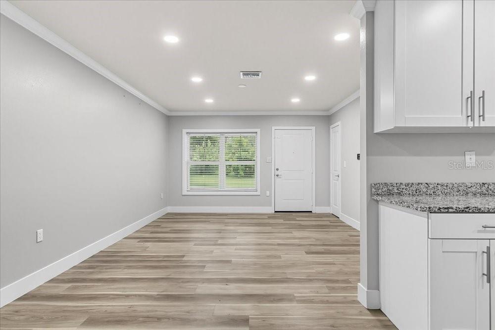 5804 Wolf Road Orlando, FL 32808 - Photo 10 of 24 a view of an empty room with a window