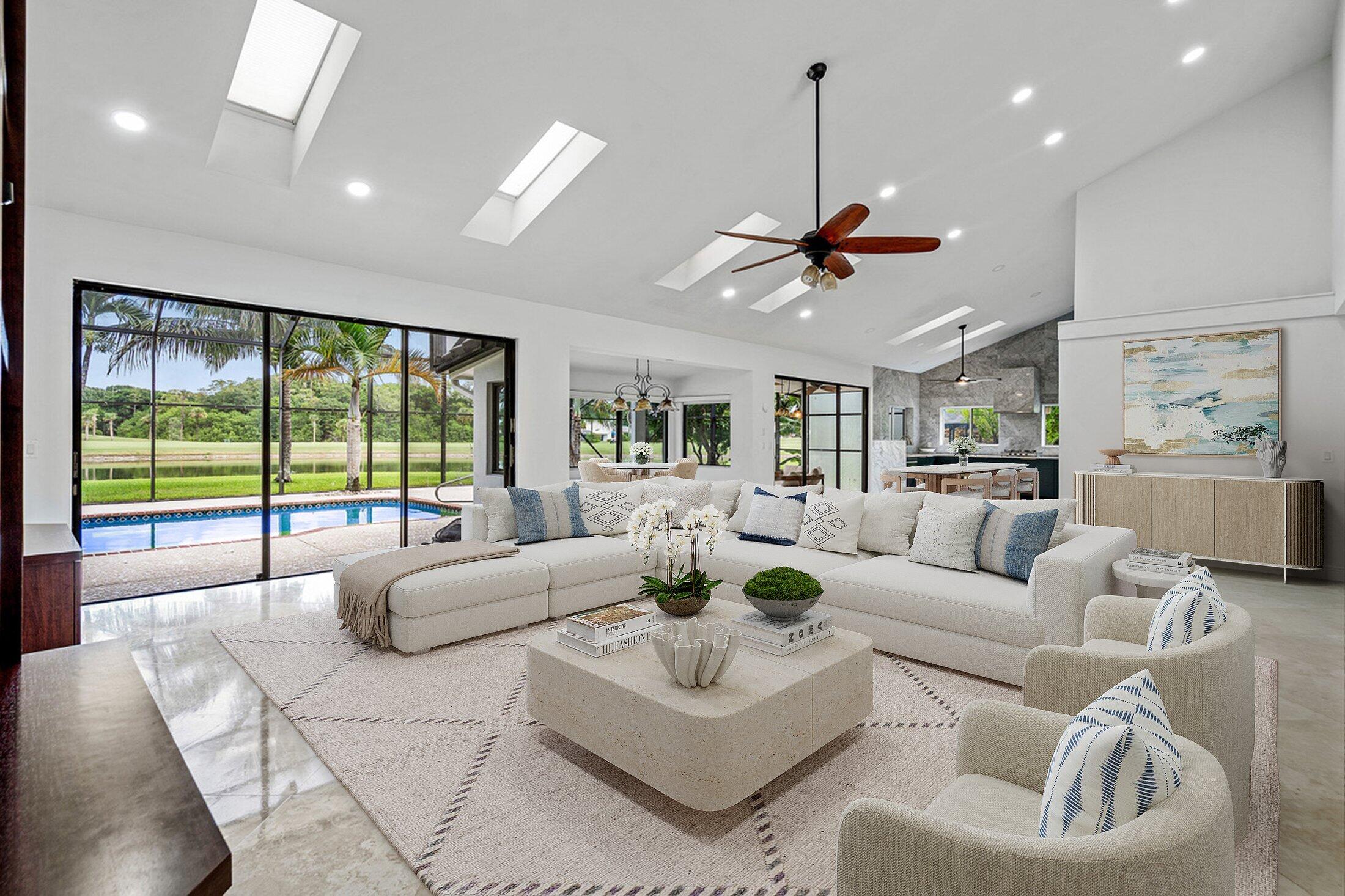 10391 Boca Woods Lane Boca Raton, FL 33428 - Photo 1 of 60 a living room with furniture ceiling fan and a large window