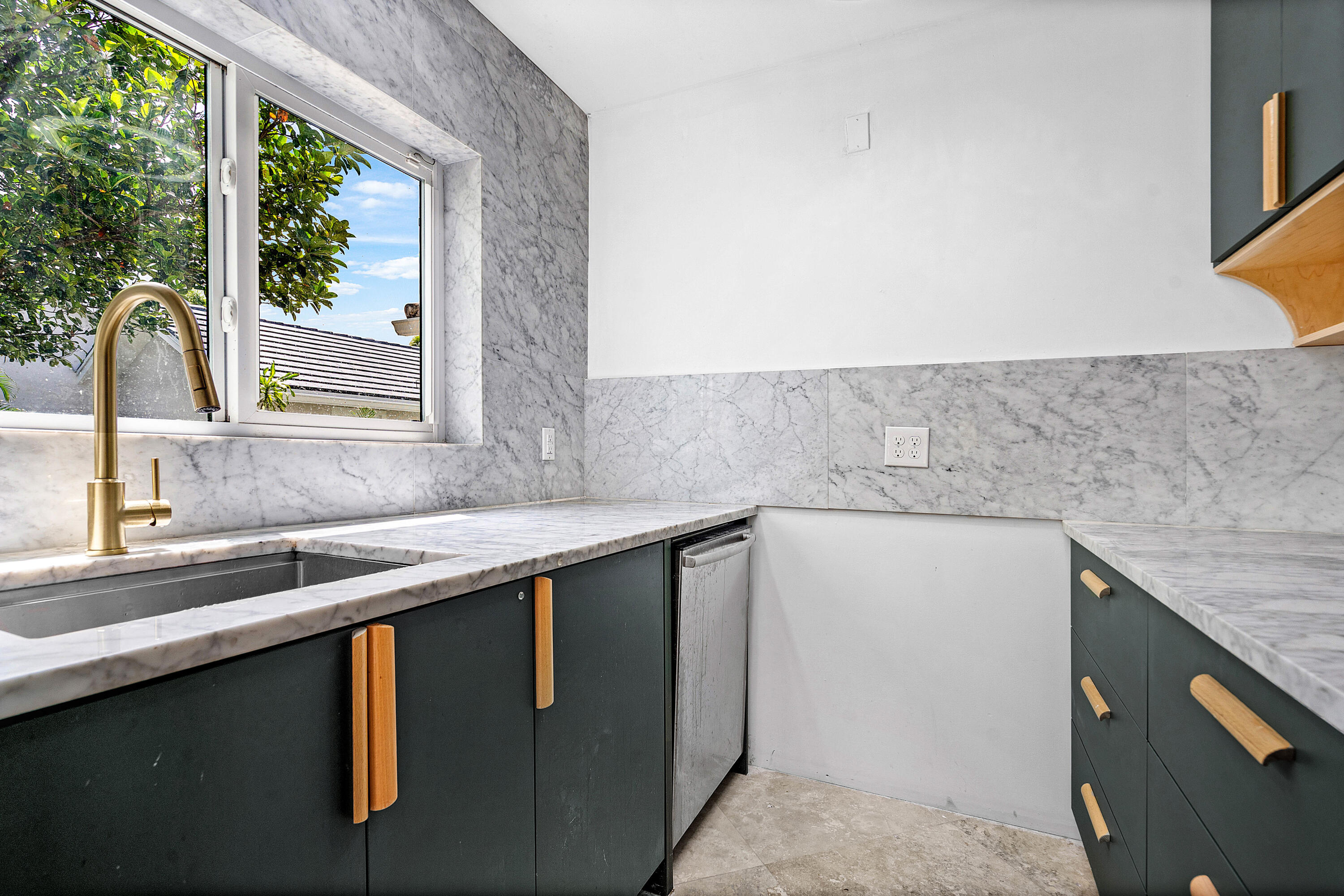 10391 Boca Woods Lane Boca Raton, FL 33428 - Photo 13 of 60 a kitchen with a sink and a window
