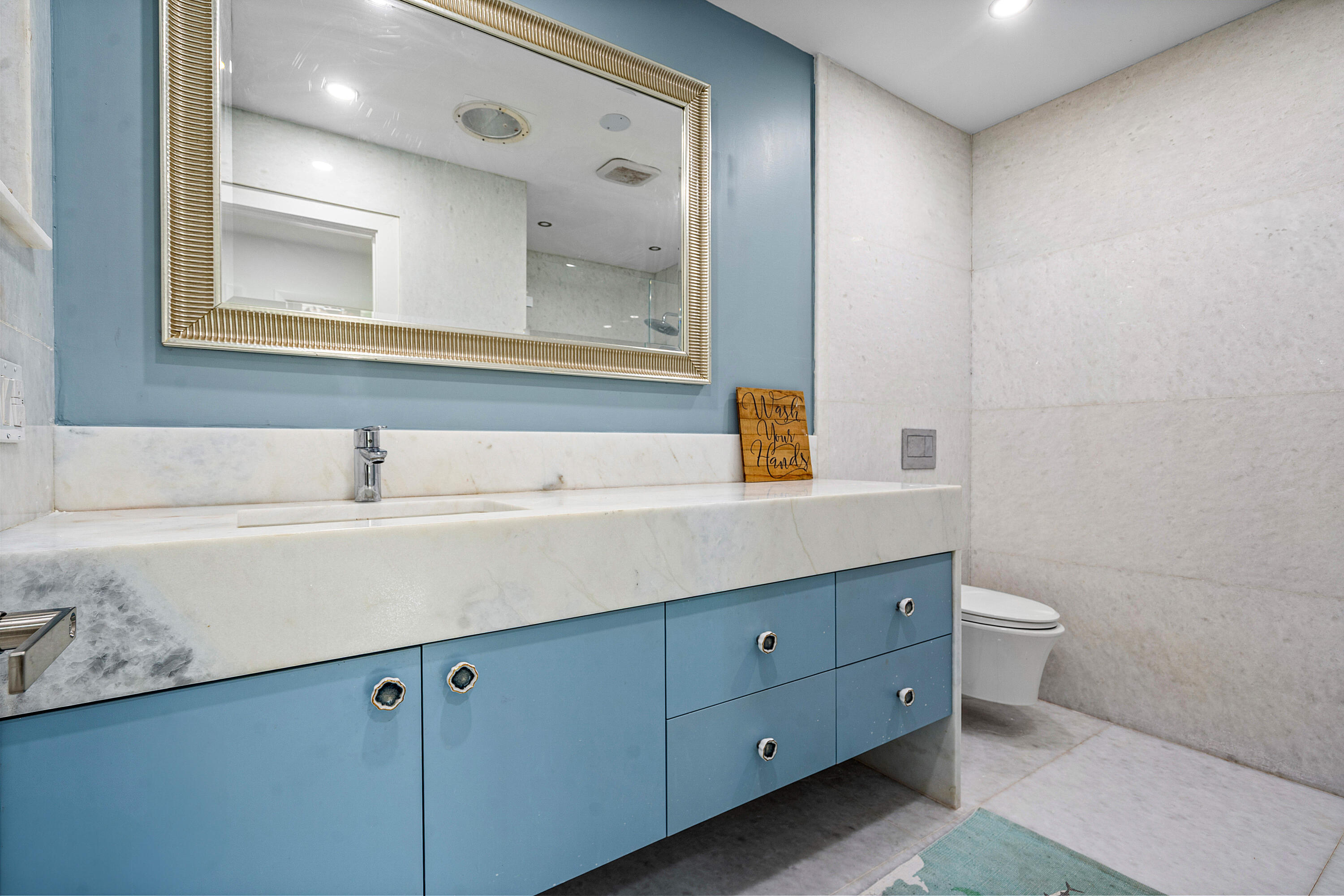 10391 Boca Woods Lane Boca Raton, FL 33428 - Photo 25 of 60 a bathroom with a double vanity sink and a mirror