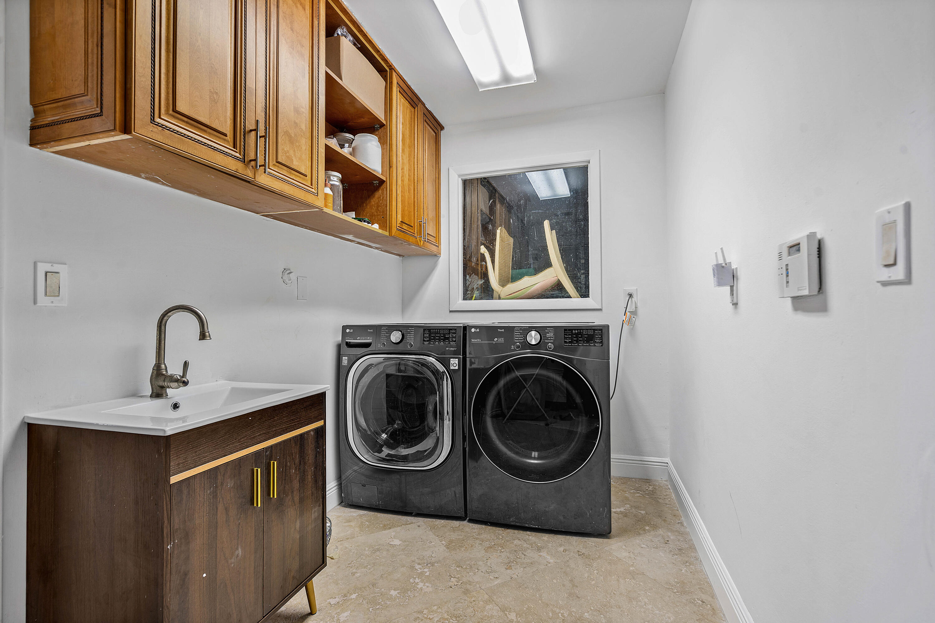 10391 Boca Woods Lane Boca Raton, FL 33428 - Photo 27 of 60 a utility room with sink dryer and washer