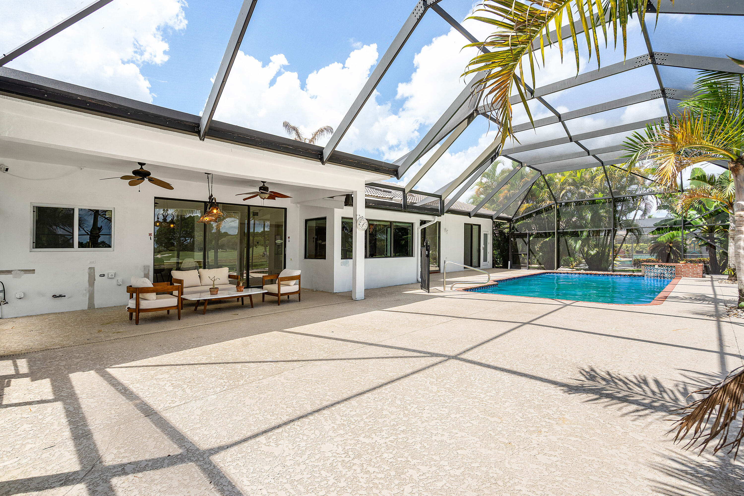 10391 Boca Woods Lane Boca Raton, FL 33428 - Photo 32 of 60 a view of a building with sitting area