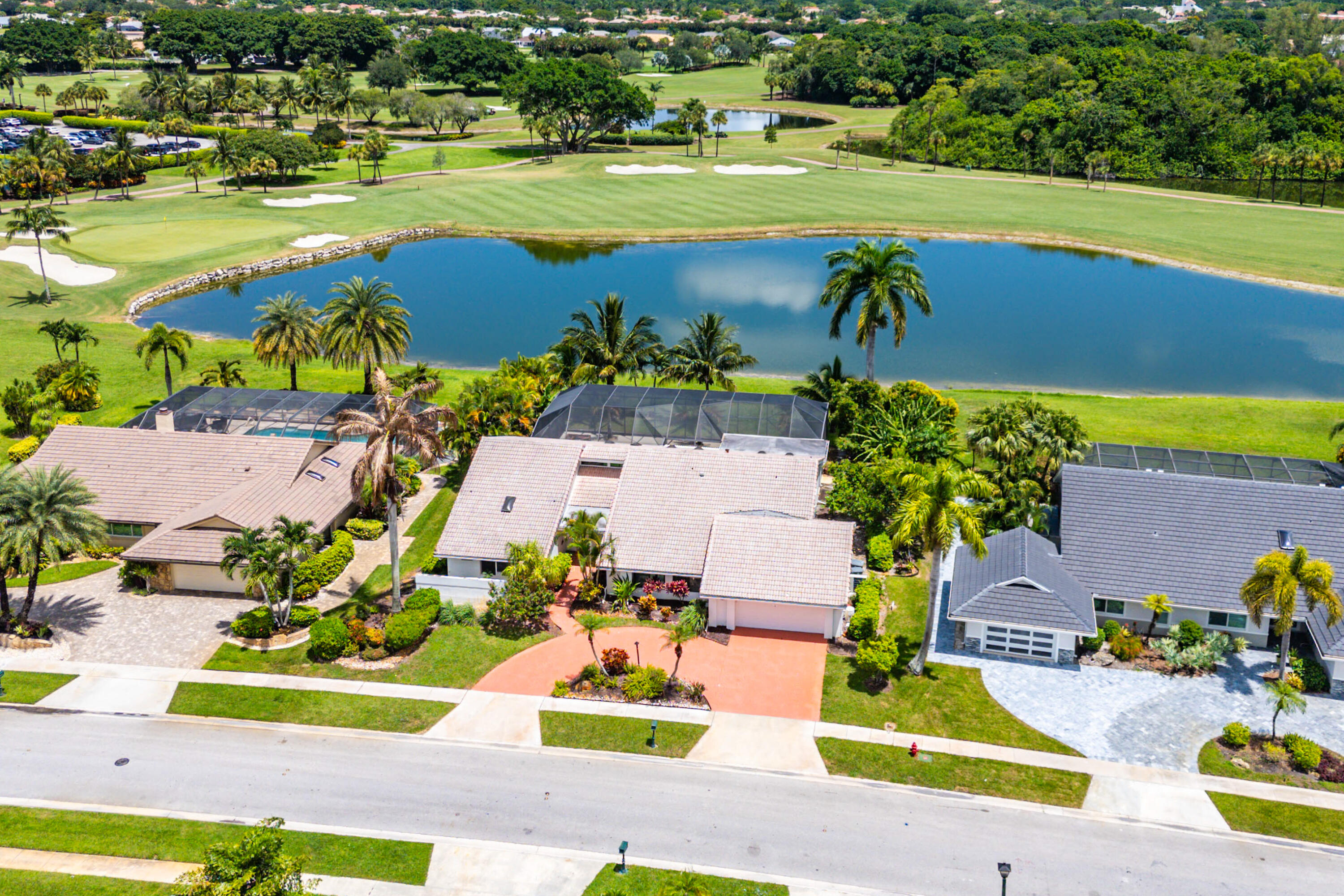 10391 Boca Woods Lane Boca Raton, FL 33428 - Photo 37 of 60 an aerial view of a house with a swimming pool yard and outdoor seating