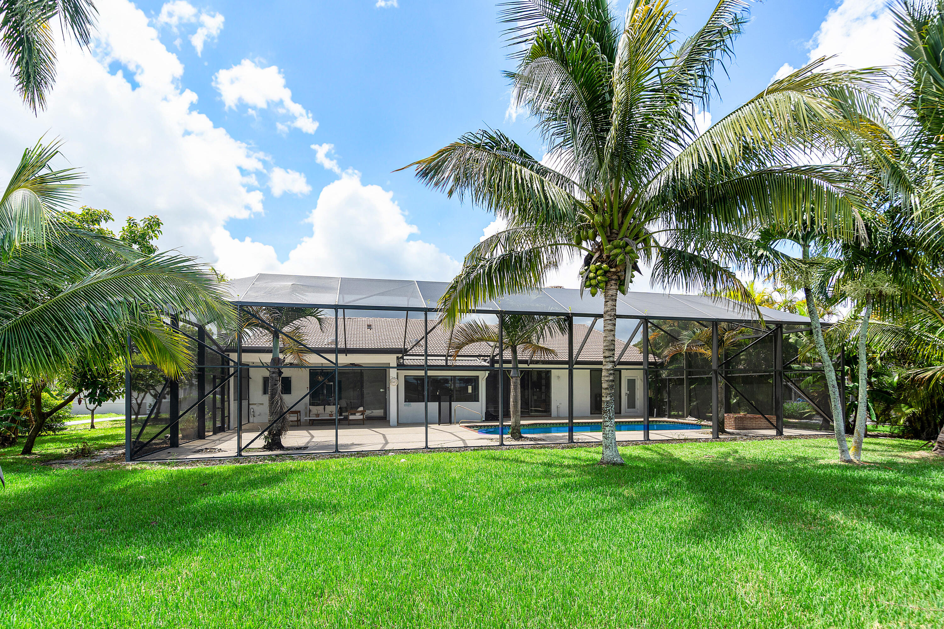 10391 Boca Woods Lane Boca Raton, FL 33428 - Photo 4 of 60 a view of a house with a backyard