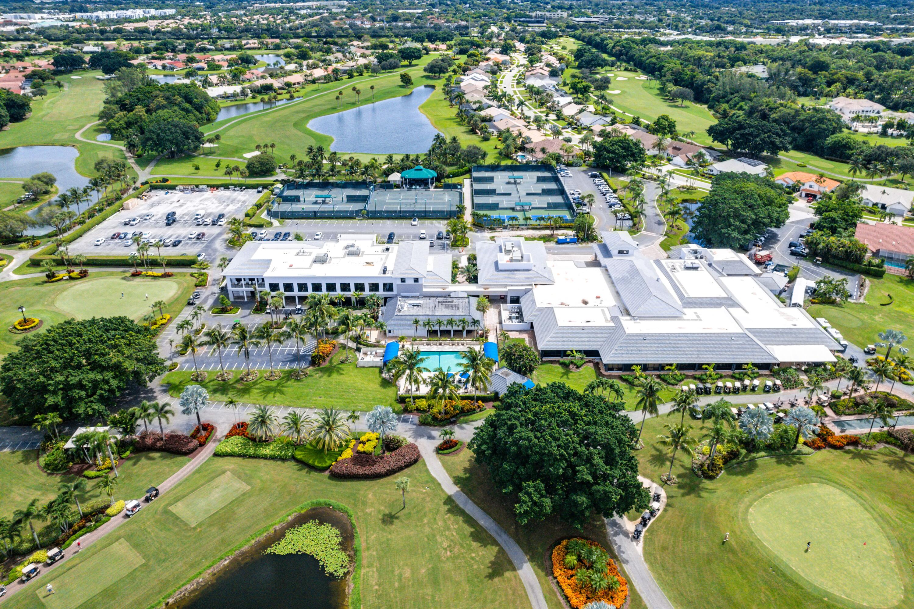 10391 Boca Woods Lane Boca Raton, FL 33428 - Photo 46 of 60 an aerial view of a house with yard swimming pool and outdoor seating