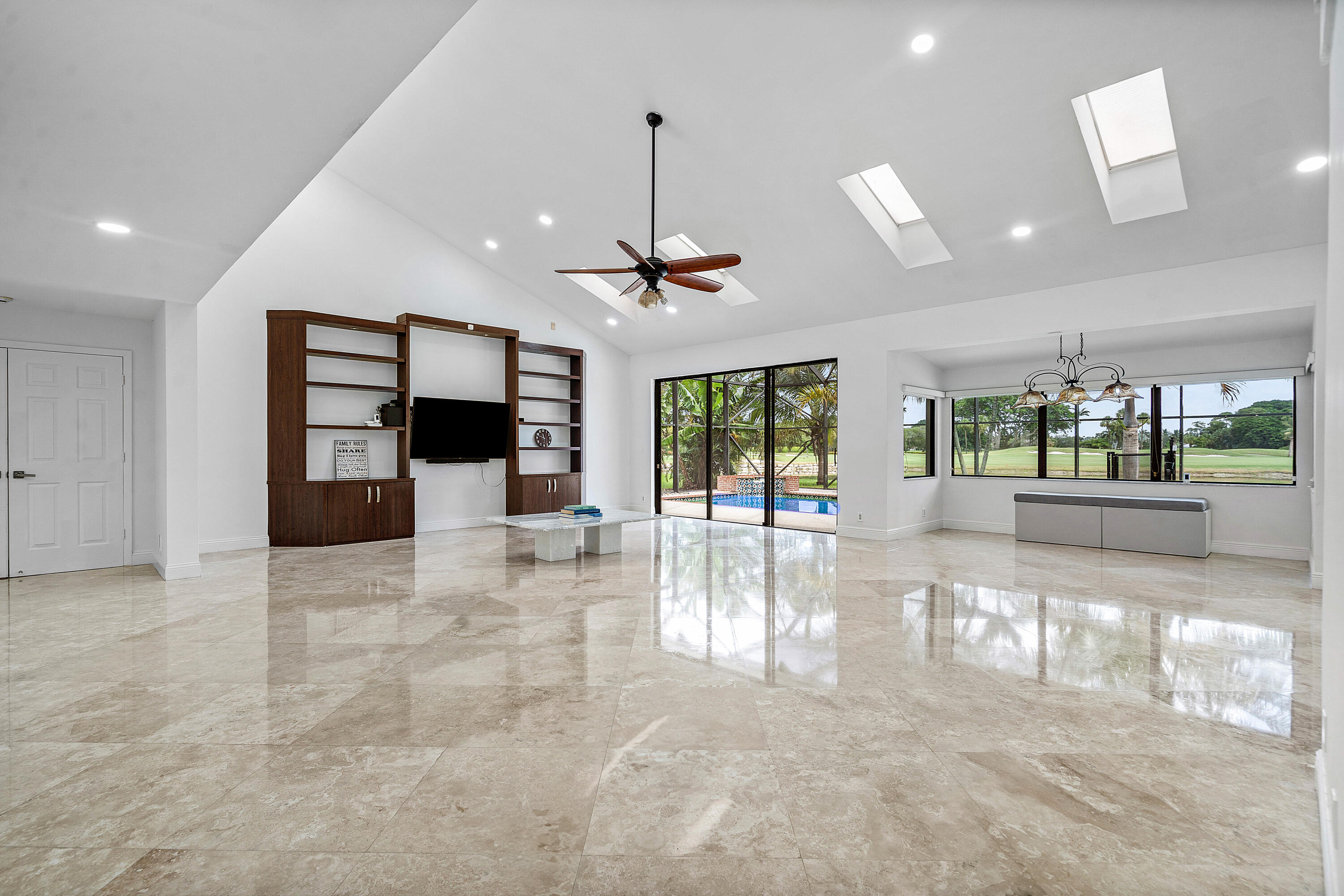 10391 Boca Woods Lane Boca Raton, FL 33428 - Photo 7 of 60 a view of a living room and chandelier