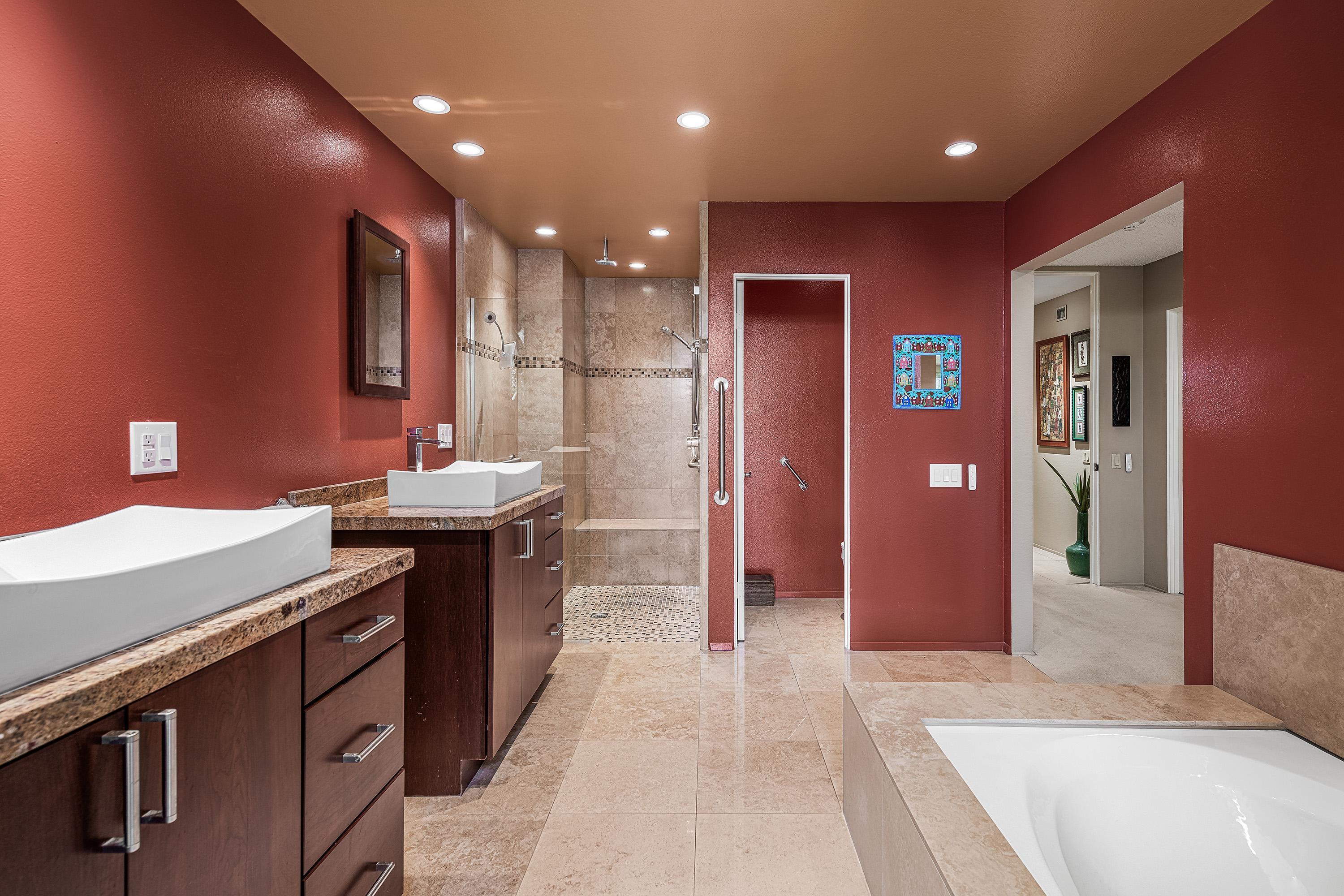 32 Cornell Drive Rancho Mirage, CA 92270 - Photo 29 of 50 a kitchen with kitchen island granite countertop a sink and a refrigerator