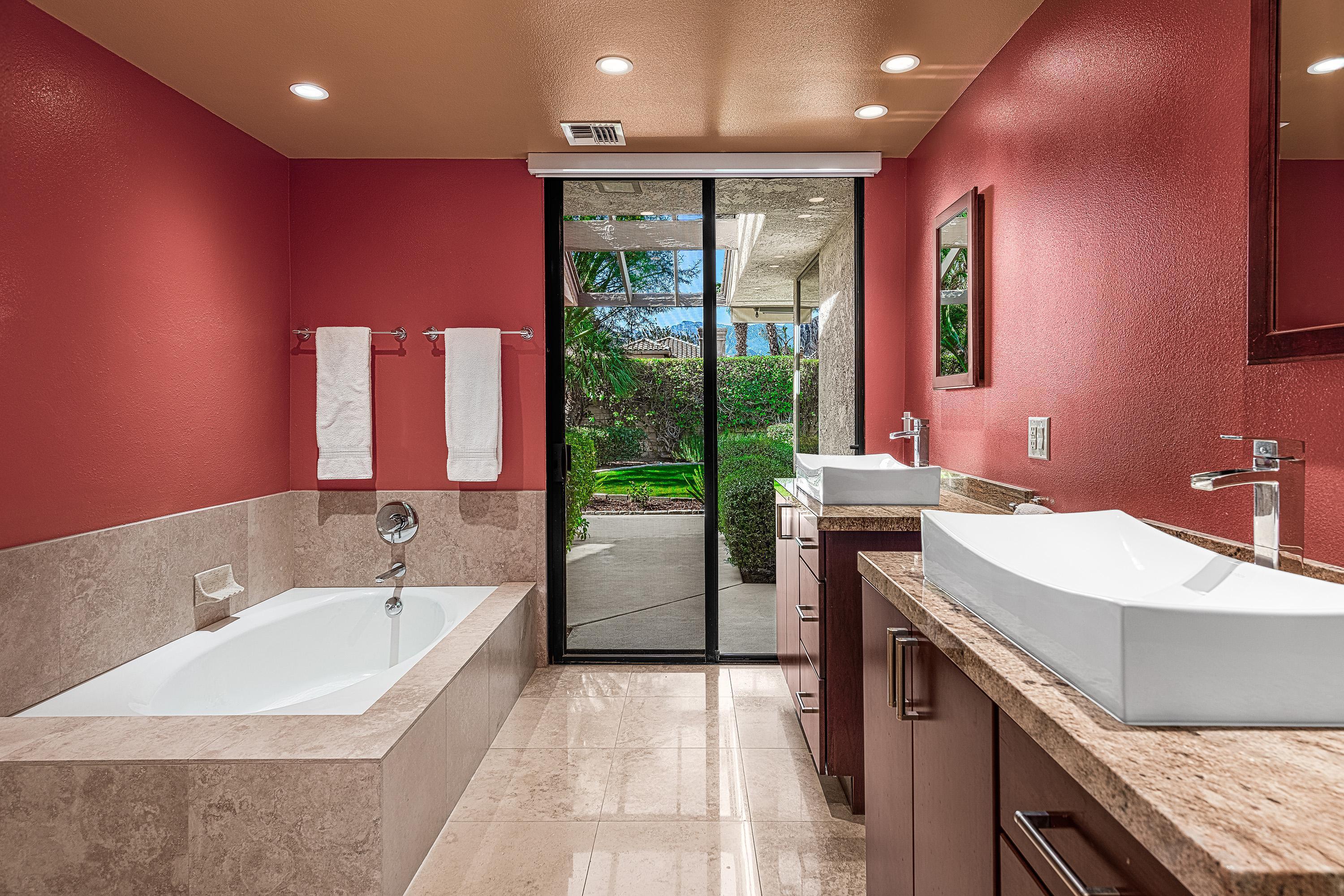 32 Cornell Drive Rancho Mirage, CA 92270 - Photo 30 of 50 a bathroom with a tub sink and mirror