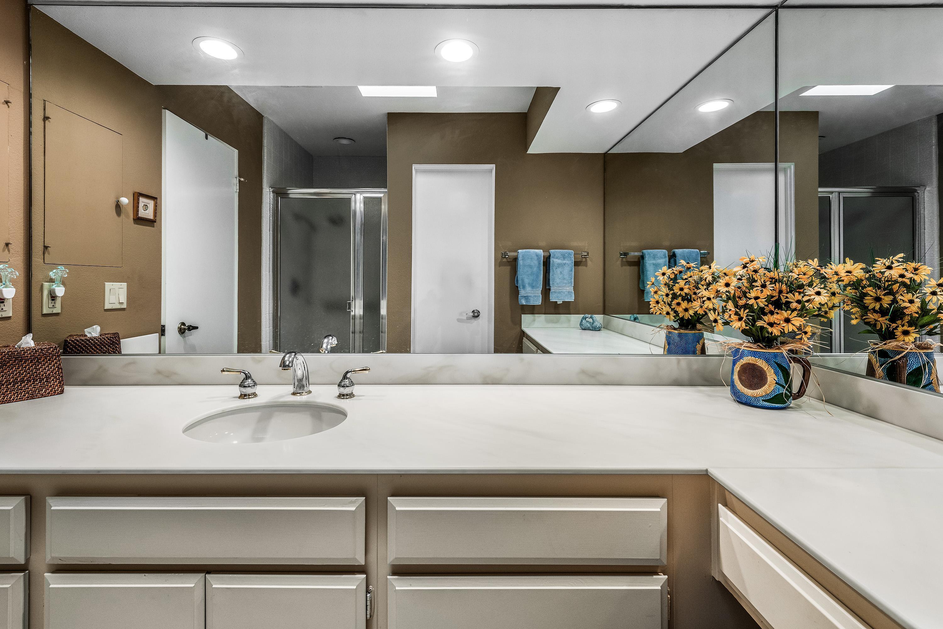 32 Cornell Drive Rancho Mirage, CA 92270 - Photo 32 of 50 a bathroom with a sink double vanity and a mirror