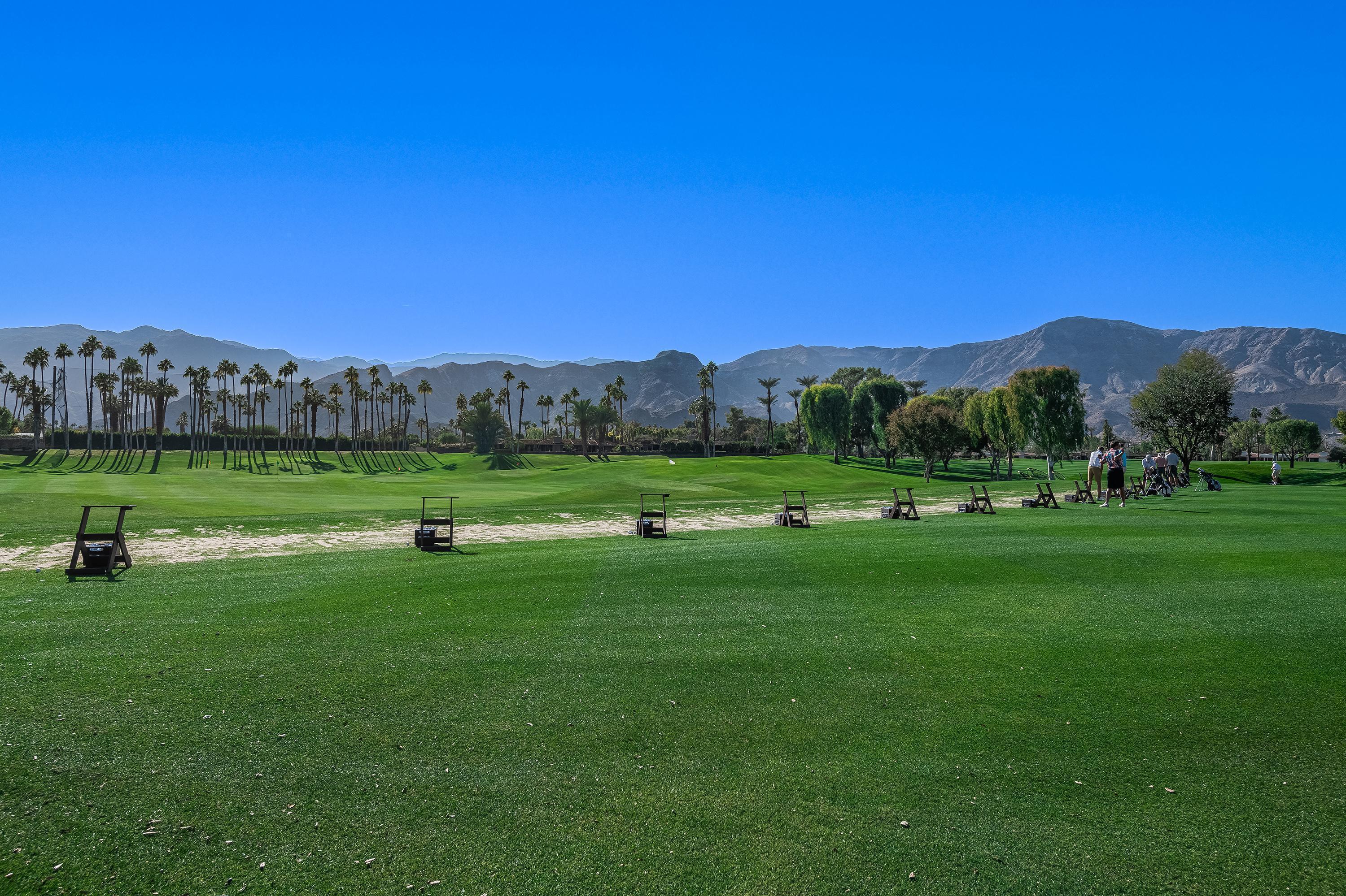 32 Cornell Drive Rancho Mirage, CA 92270 - Photo 48 of 50 a view of a grassy field with mountains in the background