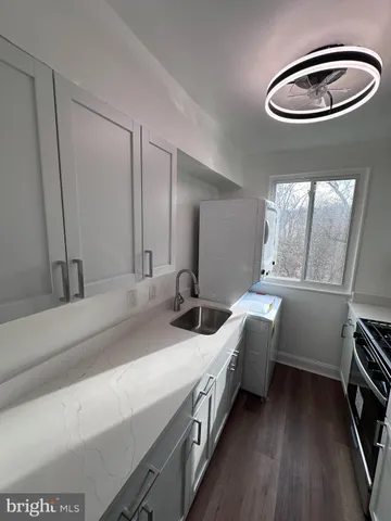a kitchen with a stove and a microwave
