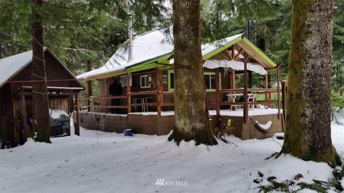 51517 South Riverside Road Gold Bar, WA 98251 - Photo 1 of 1 a front view of a house with a yard