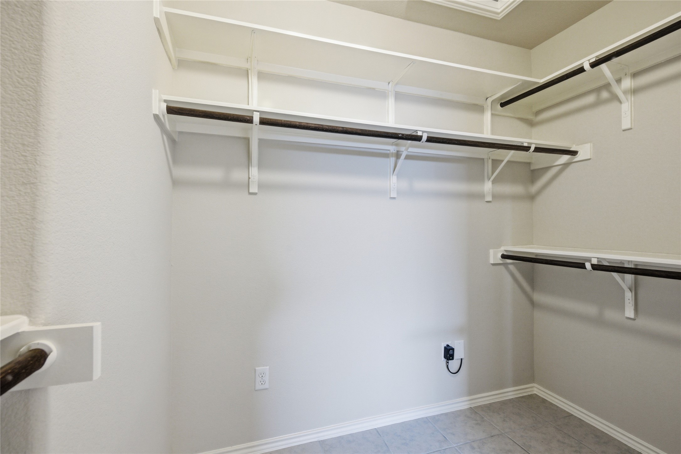 19325 Stokes Lane Pflugerville, TX 78660 - Photo 11 of 24 Walk in closet with light tile patterned floors