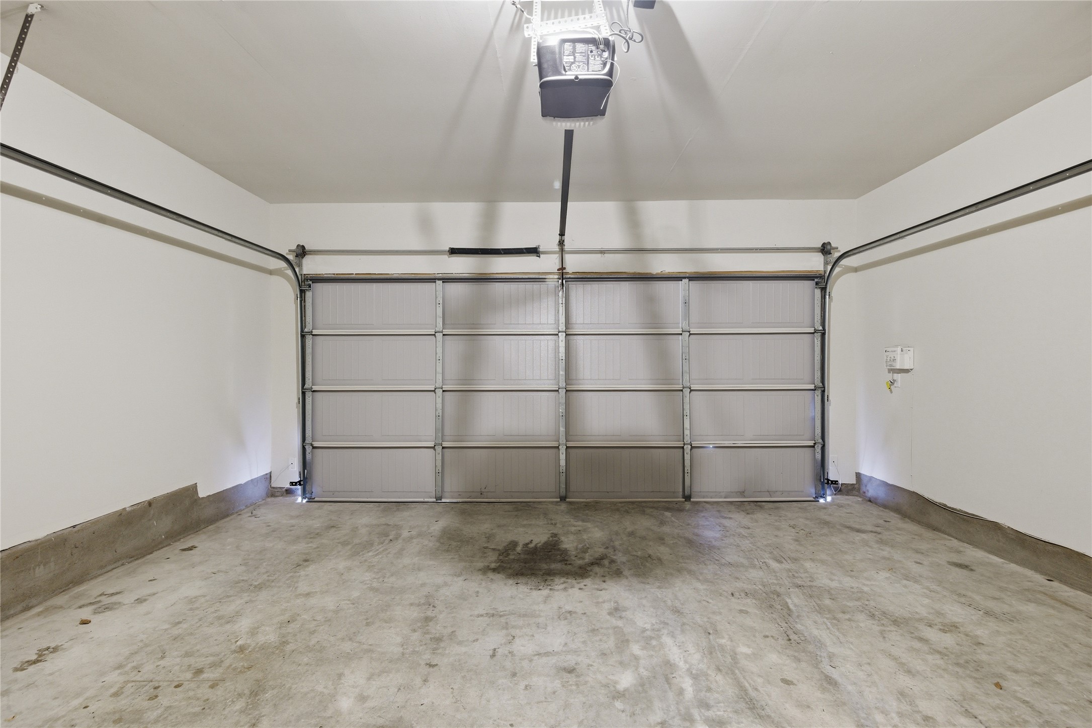 19325 Stokes Lane Pflugerville, TX 78660 - Photo 16 of 24 Garage featuring a garage door opener