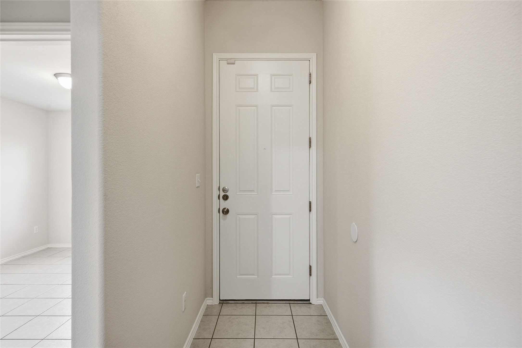 19325 Stokes Lane Pflugerville, TX 78660 - Photo 19 of 24 Entryway with tile patterned flooring and baseboards