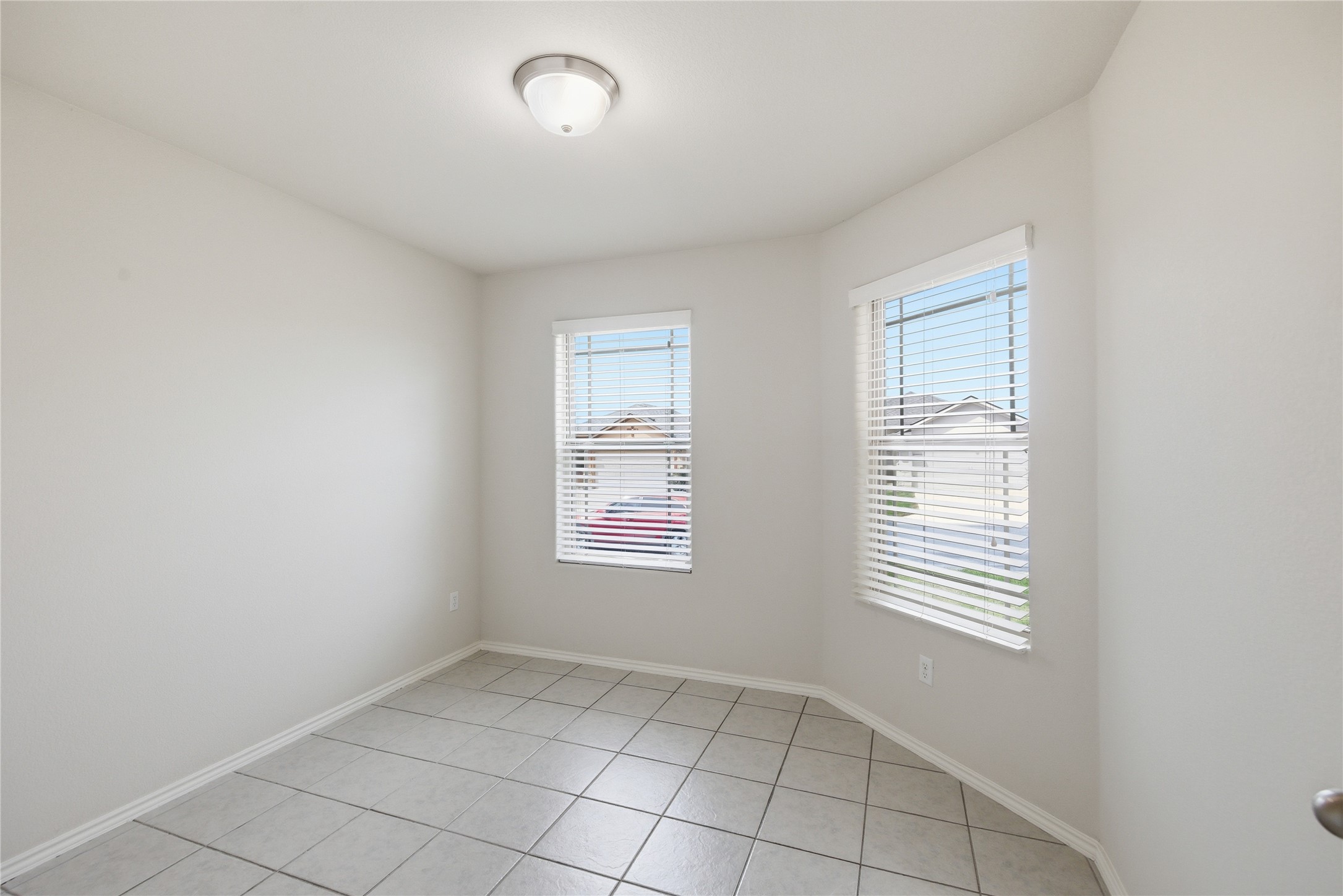 19325 Stokes Lane Pflugerville, TX 78660 - Photo 20 of 24 Empty room with baseboards and light tile patterned floors