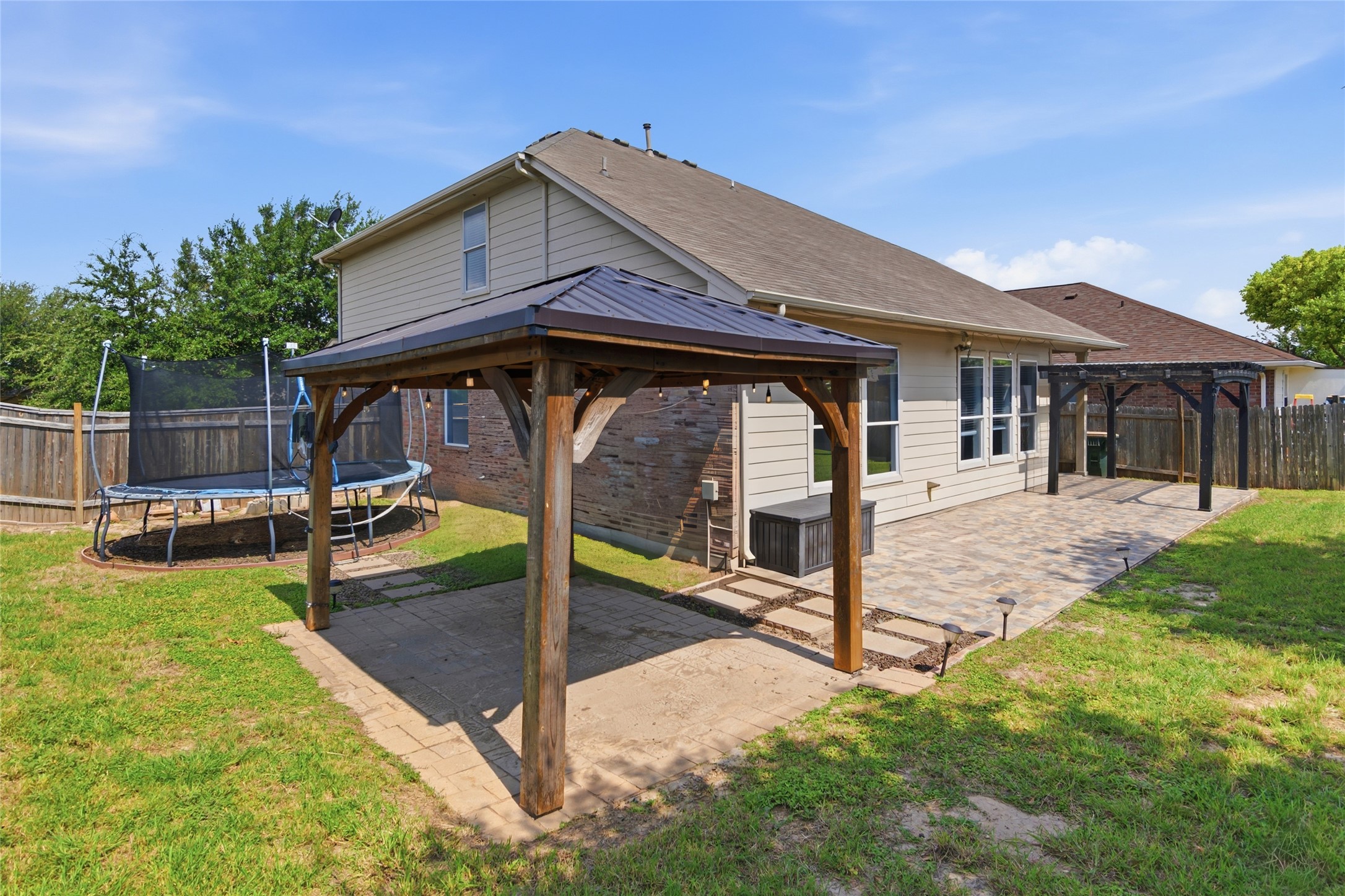 1271 Stone Rim Loop Buda, TX 78610 - Photo 37 of 40 EXTENDED PATIO AND PERGOLAS
