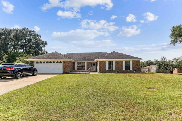 a view of a house with a big yard