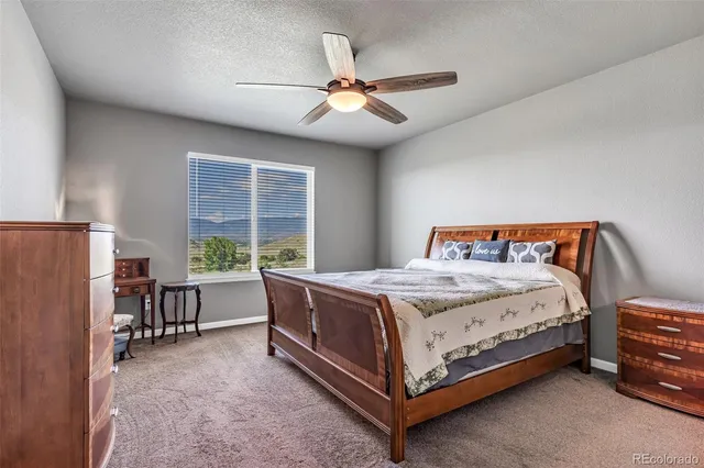 a bedroom with a bed and a table