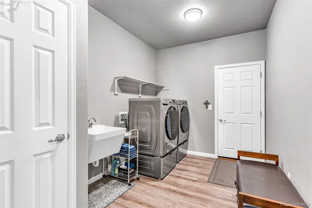 a view of a storage & utility room with washer and dryer