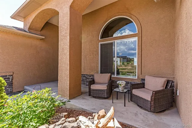 a outdoor living space with furniture and a potted plant