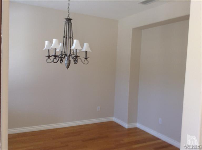 2564 Cloverleaf Lane Simi Valley, CA 93063 - Photo 2 of 30 a view of a room with a hanging light and kitchen