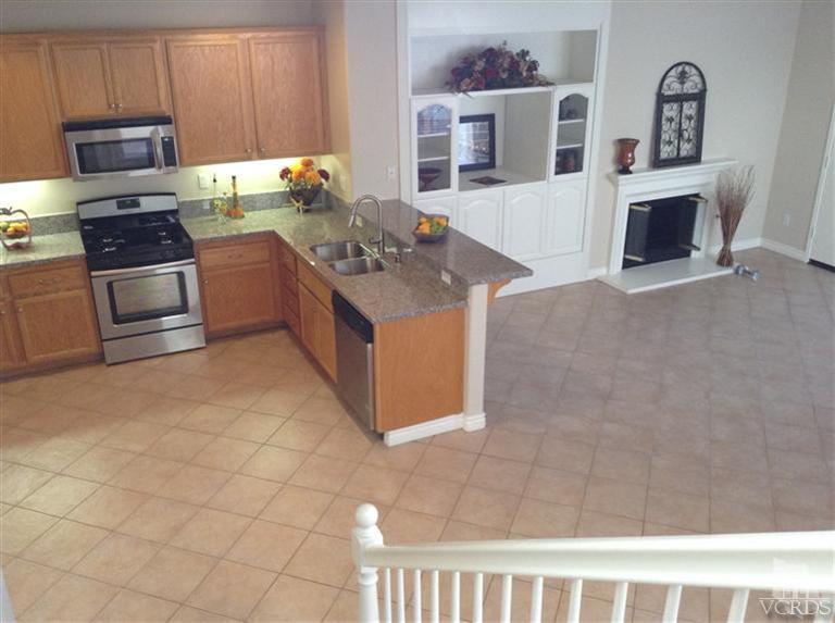 2564 Cloverleaf Lane Simi Valley, CA 93063 - Photo 13 of 30 a kitchen with stainless steel appliances granite countertop a stove a sink and a microwave