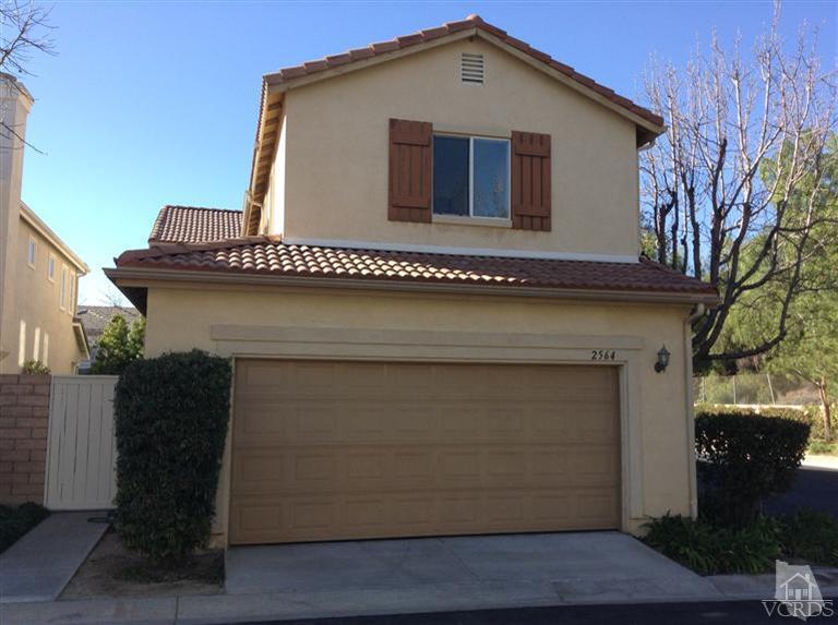 2564 Cloverleaf Lane Simi Valley, CA 93063 - Photo 27 of 30 a front view of a house with a garage