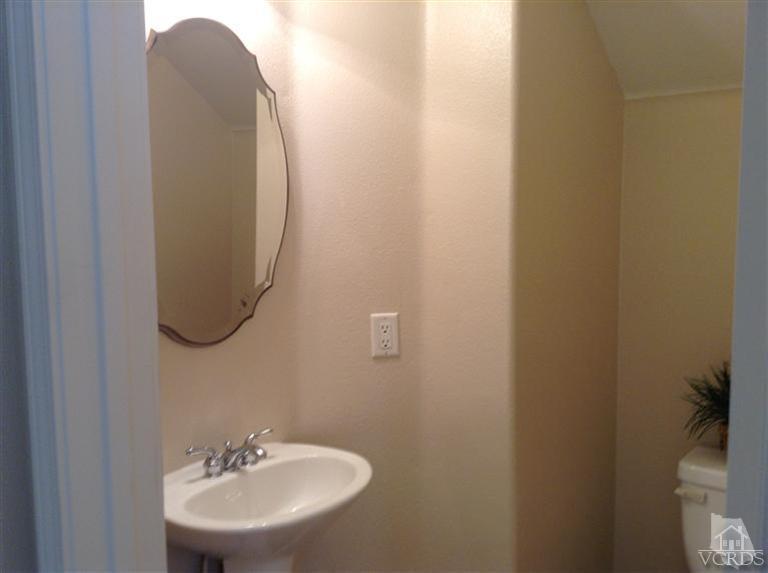 2564 Cloverleaf Lane Simi Valley, CA 93063 - Photo 6 of 30 a bathroom with a sink and mirror