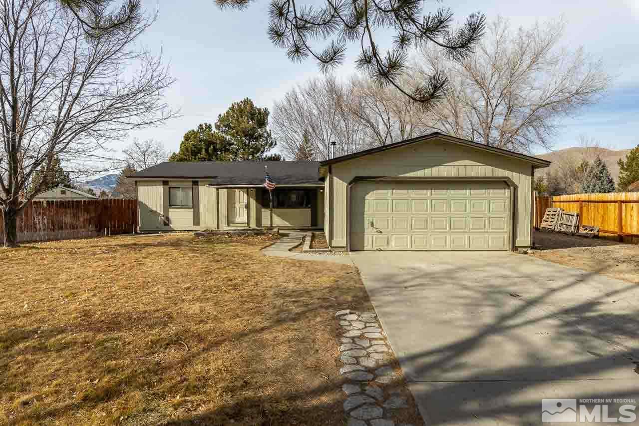 3945 Brant Street Reno, NV 89508 - Photo 1 of 19 a front view of a house with a yard