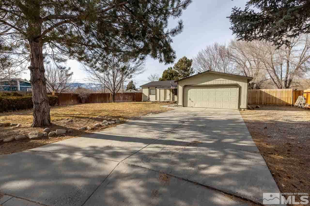 3945 Brant Street Reno, NV 89508 - Photo 2 of 19 a front view of a house with a yard