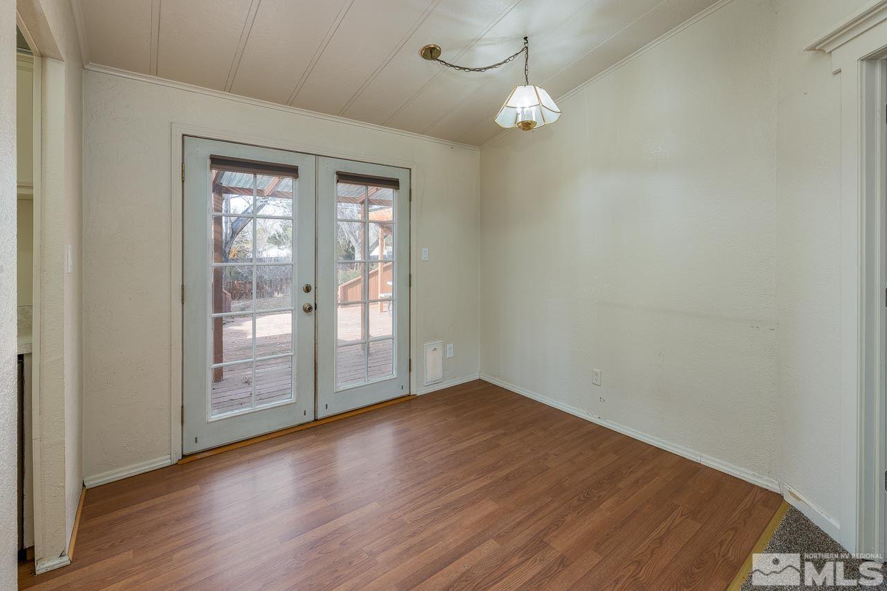 3945 Brant Street Reno, NV 89508 - Photo 4 of 19 an empty room with wooden floor and windows