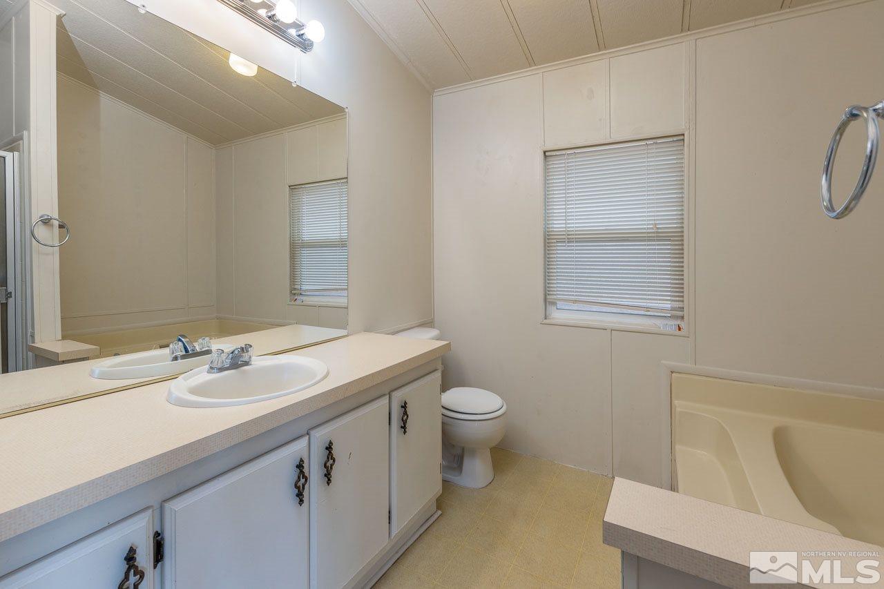 3945 Brant Street Reno, NV 89508 - Photo 9 of 19 a bathroom with a sink a toilet and shower